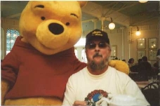 This was taken in Nov. 2003 at Disney World at the Crystal Palace, the waiter asked me if it was ok to take a pix......That Pooh Bear was a Big ABB fan and would really Appreciate my Time.......
